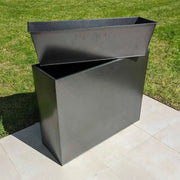 Trough planters on the patio, filled with herbs